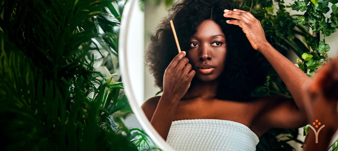 Black woman combing afro textured hair