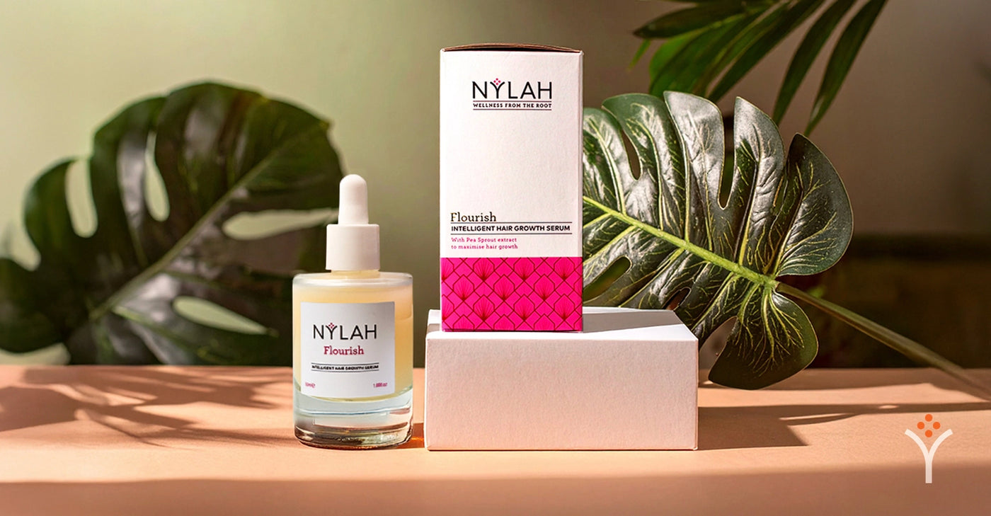 Nylah's Naturals Flourish Intelligent Hair Growth Serum around plants